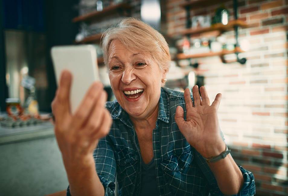 senior lady face timing on the phone