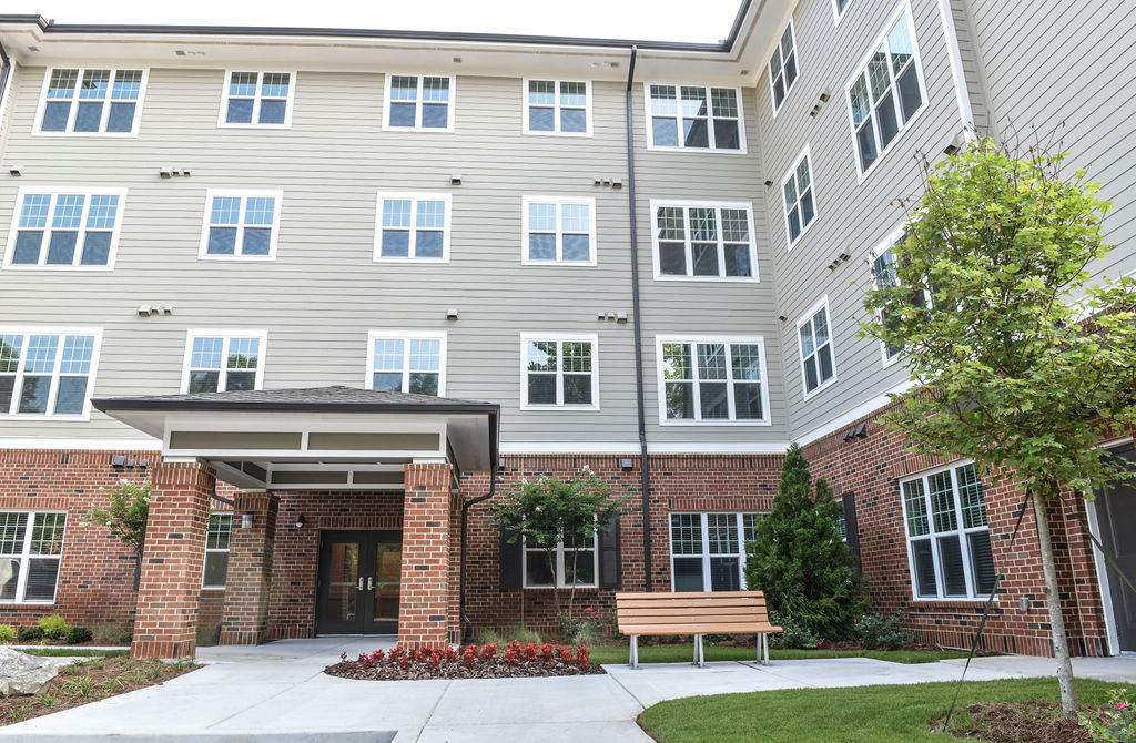 An exterior shot of the entrance of True Light Haven, an affordable housing community