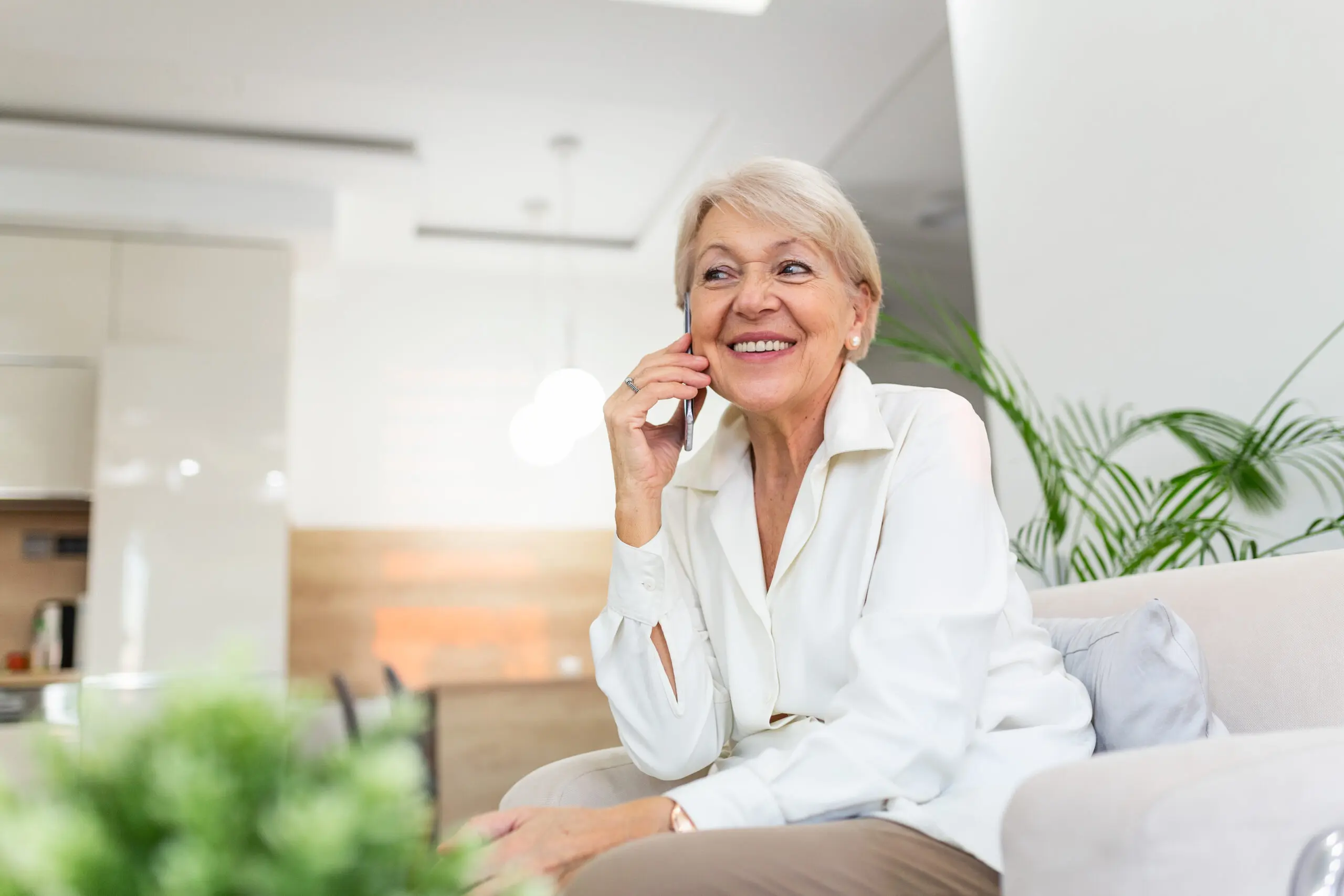 A happy older woman after moving into senior independent living for adults.